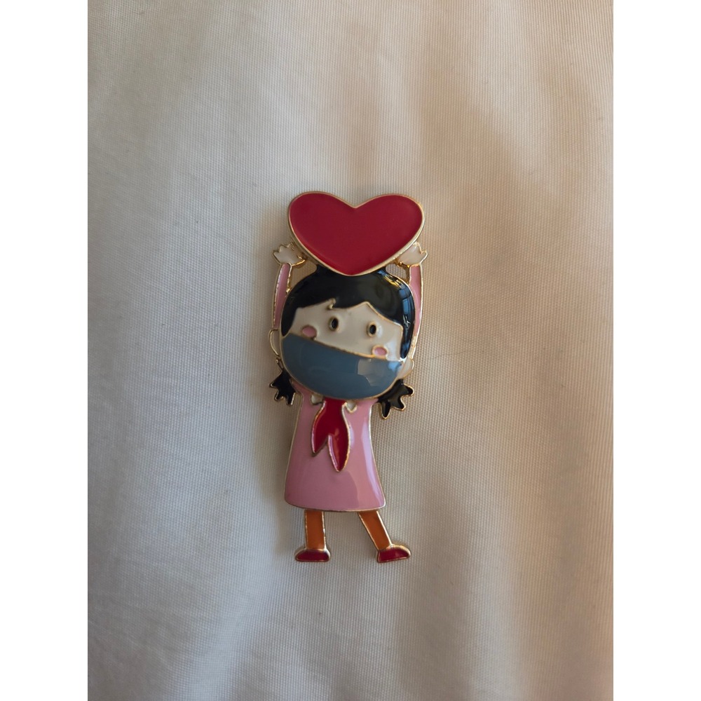Girl Wearing Face Mask Holding Red Heart Enamel Pin Gold Tone Lapel Accessory